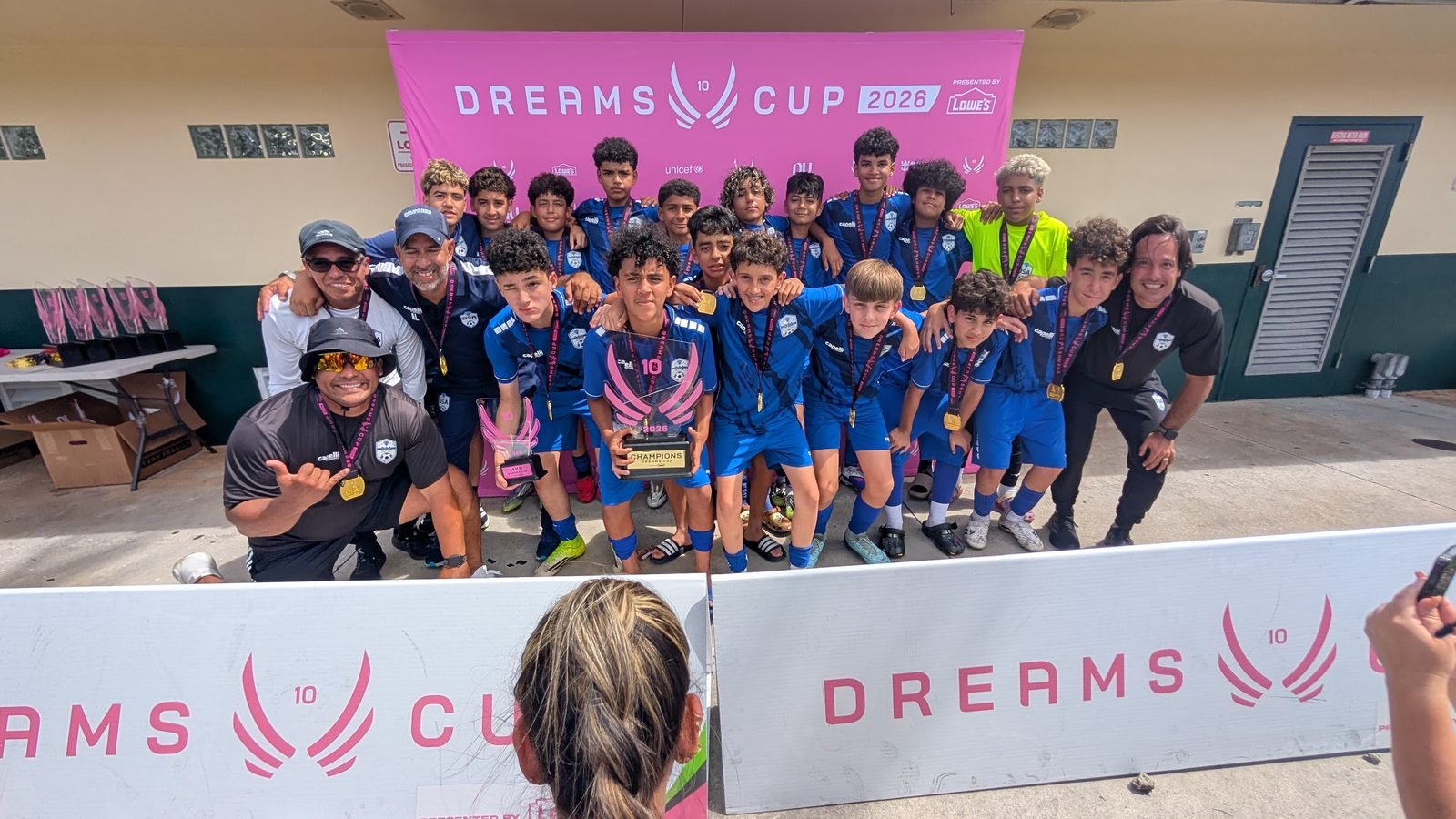 DSA players and coaches with their Dreams Cup 2026 trophy
